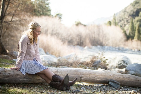 Alex smiling through the forest